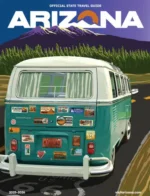 Arizona Travel Guide: A scenic view of the Grand Canyon at sunset with layers of red rock and a clear blue sky in Arizona.