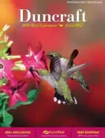 Duncraft Catalog: A wooden bird feeder filled with sunflower seeds hanging from a tree branch with a cardinal nearby.