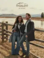 Overland Outfitters Catalog: A close-up of a canvas and leather storage bag attached to a Jeep's passenger grab handle.