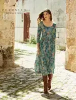 Peruvian Connection Catalog: Artisan-crafted alpaca sweater and pima cotton clothing from a luxury fashion catalog.