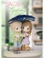 Precious Moments Catalog: A detailed view of several Precious Moments porcelain figurines arranged as they would appear in a collector's catalog.