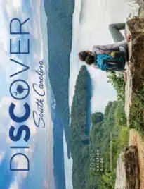 South Carolina Travel Guide: A scenic view of the South Carolina coast featuring palmetto trees and a sunset over the Atlantic Ocean.