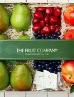The Fruit Company Catalog: A variety of fresh pears and apples arranged in a gift basket from a fruit catalog.