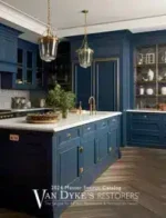 Van Dyke's Restorers: Antique brass cabinet hardware and restoration tools on a wooden workbench.