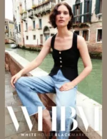 White House Black Market Catalog: A sophisticated woman wearing a tailored black blazer and white trousers from the White House Black Market collection.