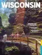 Wisconsin Travel Guide: A scenic view of a lighthouse on the rocky coast of Lake Michigan in Door County